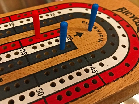Close up of part of a Cribbage Board