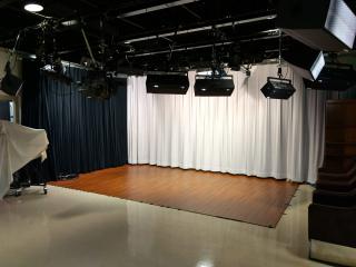 View of NCAT studio with curtain backdrops and professional lighting equipment